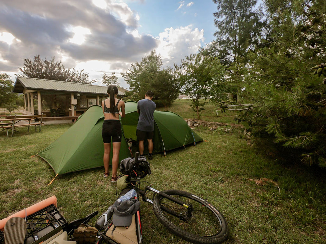 NatureHike Opalus4 four person tent set up on a bikepacking trip.
